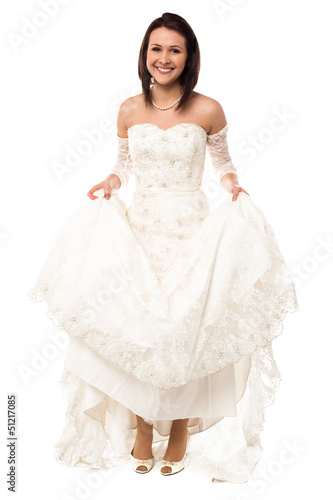 Bride holding up her gown exposing her feet