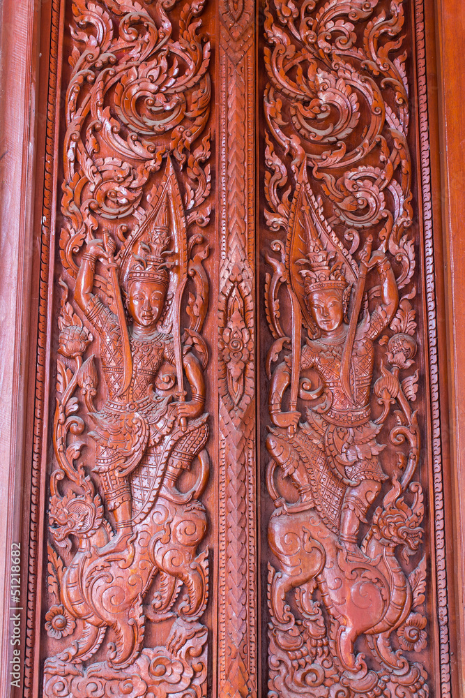 Ornament wooden door of Thai temple in Chiangmai, Thailand