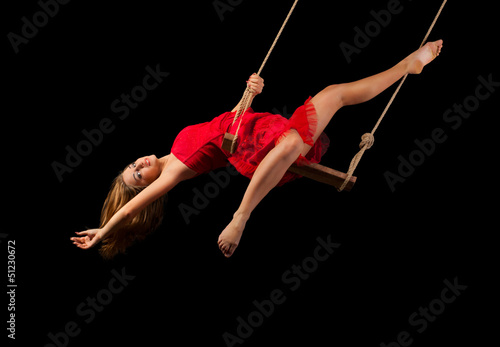 Young woman gymnast on rope photo