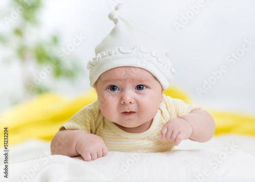 infant baby boy lying on st...