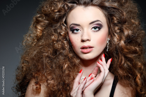 Wallpaper Mural Young beautiful woman with long curly hairs Torontodigital.ca