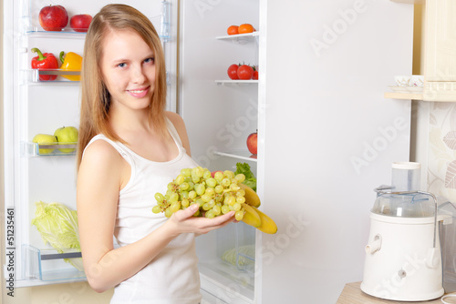 girl near the refrigerator
