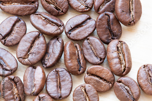 coffee beans on white wooden background photo