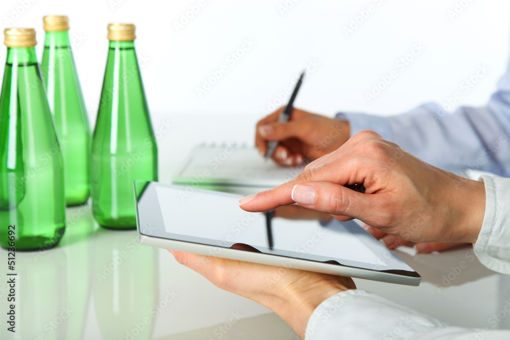 Two businesswomen working with digital tablet Two businesswomen working with digital tablet