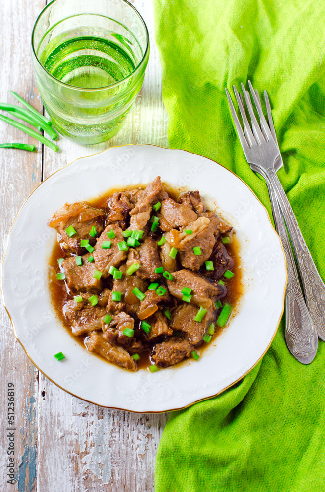.Beef stewed in beer with onions .Beef stewed in beer with onions