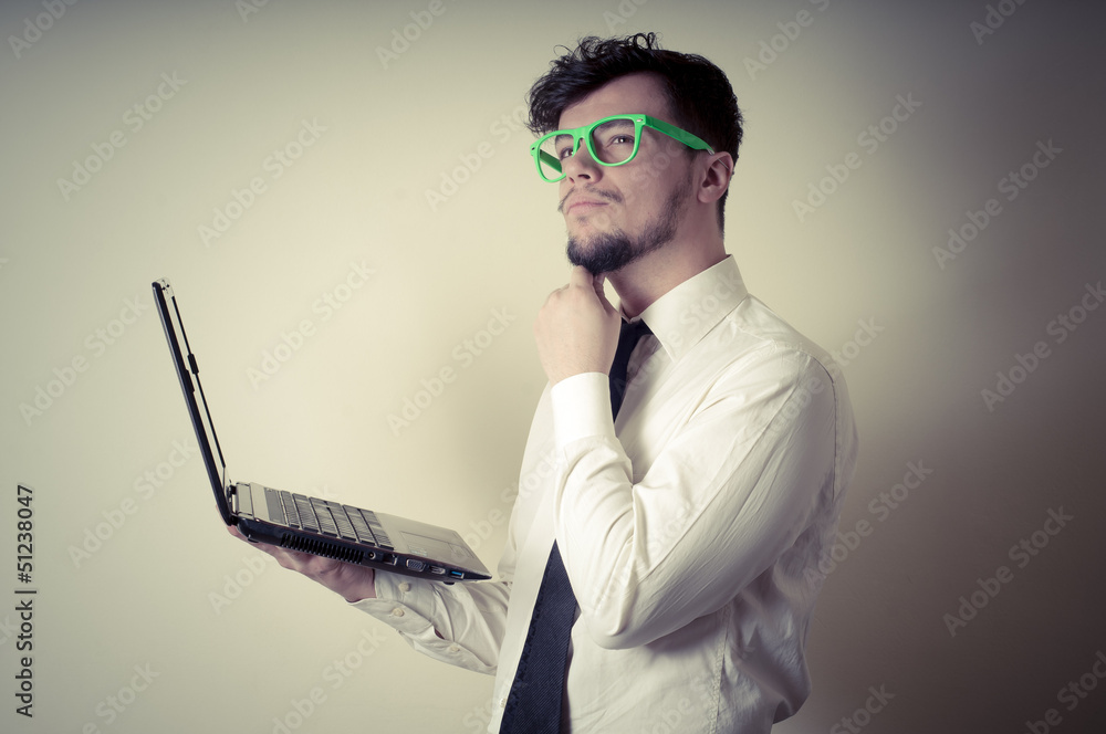 © Eugenio Marongiu - businessman using notebook on gray background