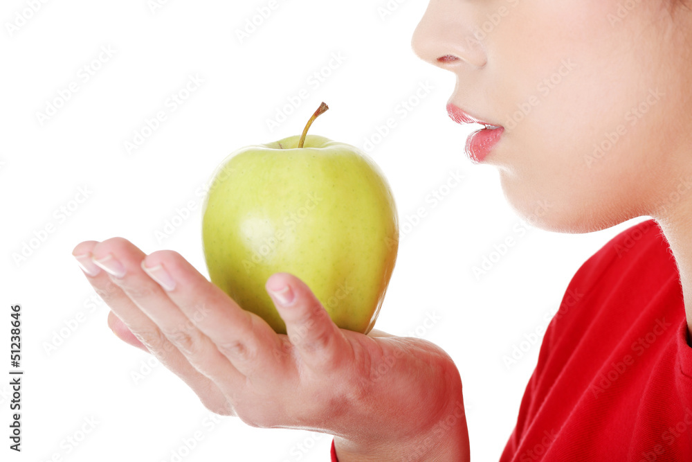 Young woman holding green fresh apple Young woman holding green fresh apple