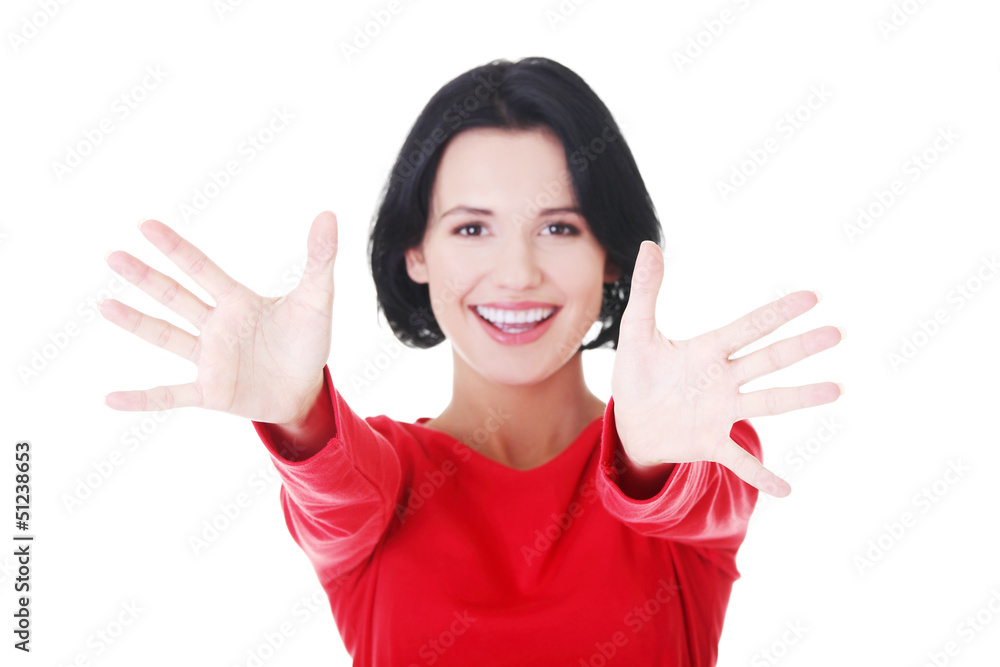 Woman pointing with both hands towards the camera Woman pointing with both hands towards the camera