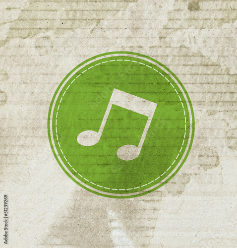 green music note on grunge paper