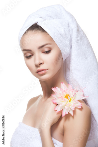 Beautiful young woman posing in white towel.