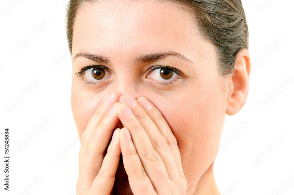 bright closeup picture of woman with hands over mouth bright closeup picture of woman with hands over mouth