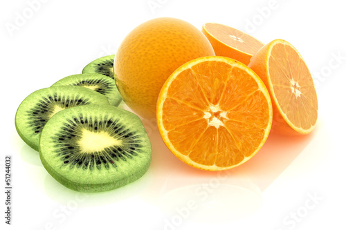 slices of kiwi, orange and half orange on a white