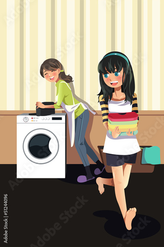 Mother daughter doing laundry