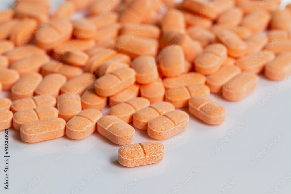 pile of medicinal orange pills pile of medicinal orange pills