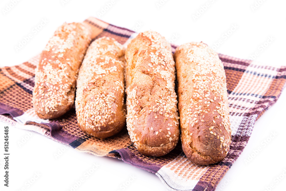 Fototapeta premium Freshly baked bread rolls with sesame