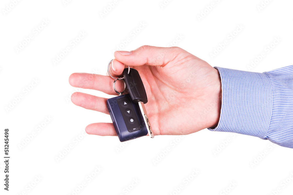 Male hand holding a car key . New car concept Male hand holding a car key . New car concept