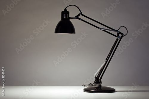Фотография Black desk lamp isolated on white