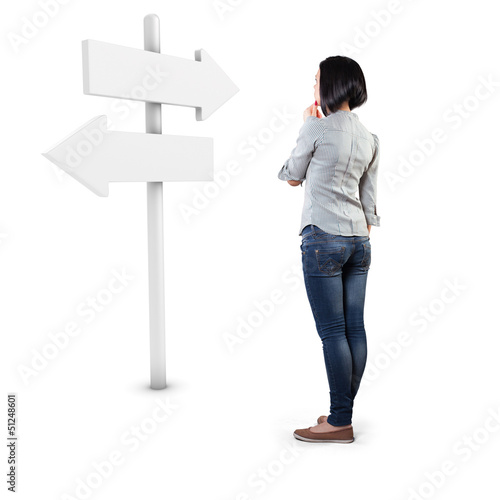 Girl before a roadsign