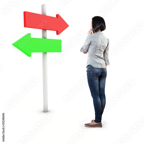 Girl before a roadsign