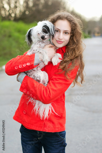 Brunette hugging little dog