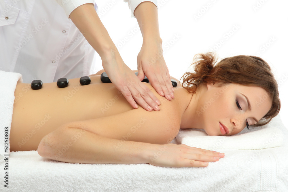 Obraz premium beautiful young woman in spa salon getting massage with spa