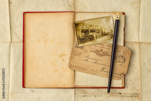 Vintage background with old post cards and empty open book