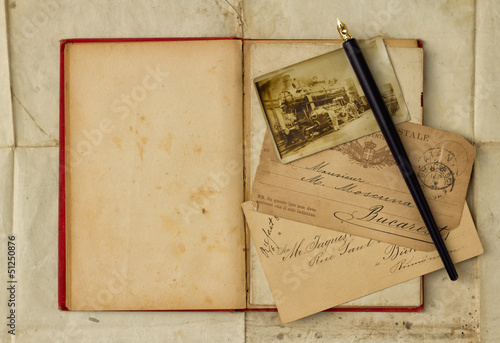 Background with vintage photograph and empty open book