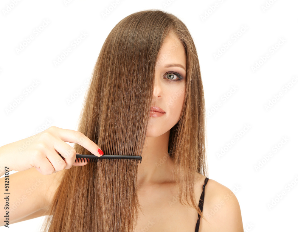 Obraz premium Portrait of beautiful woman brushing her hair, isolated on