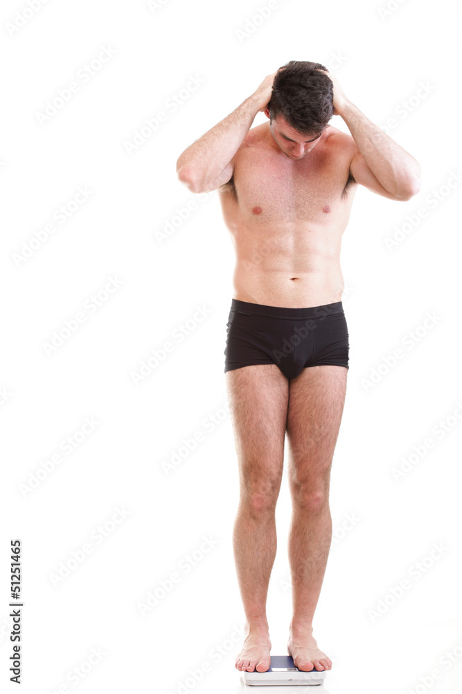 Healthy young man man standing on scales scale Isolated Healthy young man man standing on scales scale Isolated