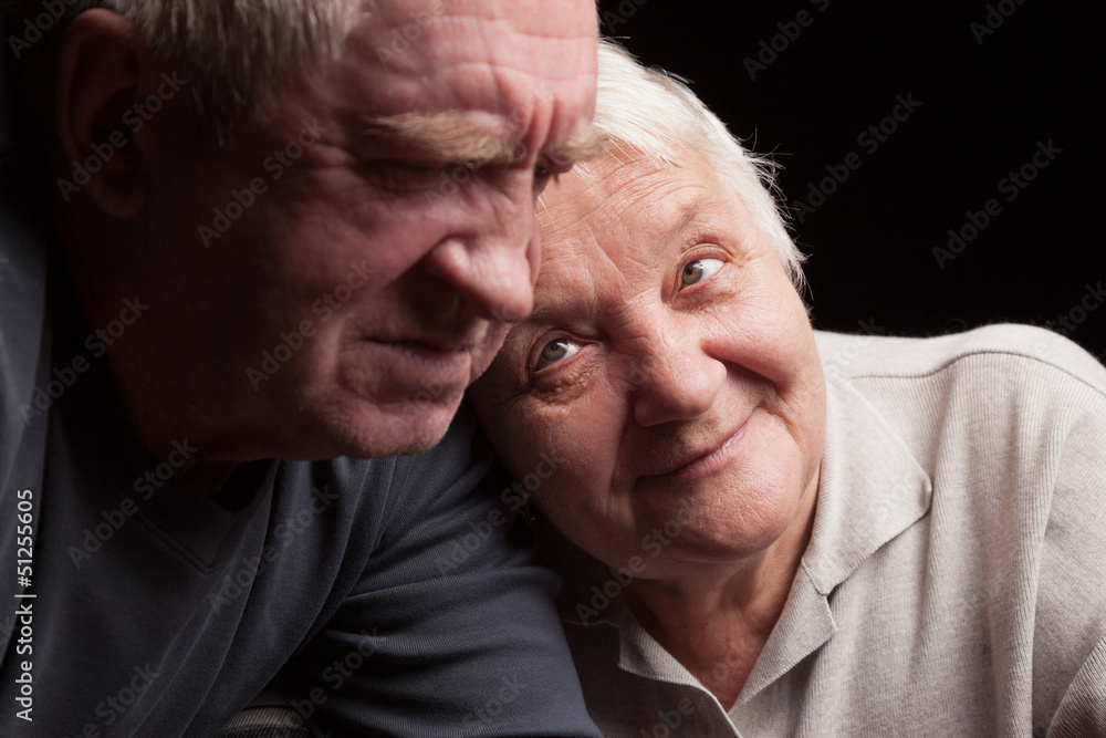 Fototapeta premium happy older pair on a black background