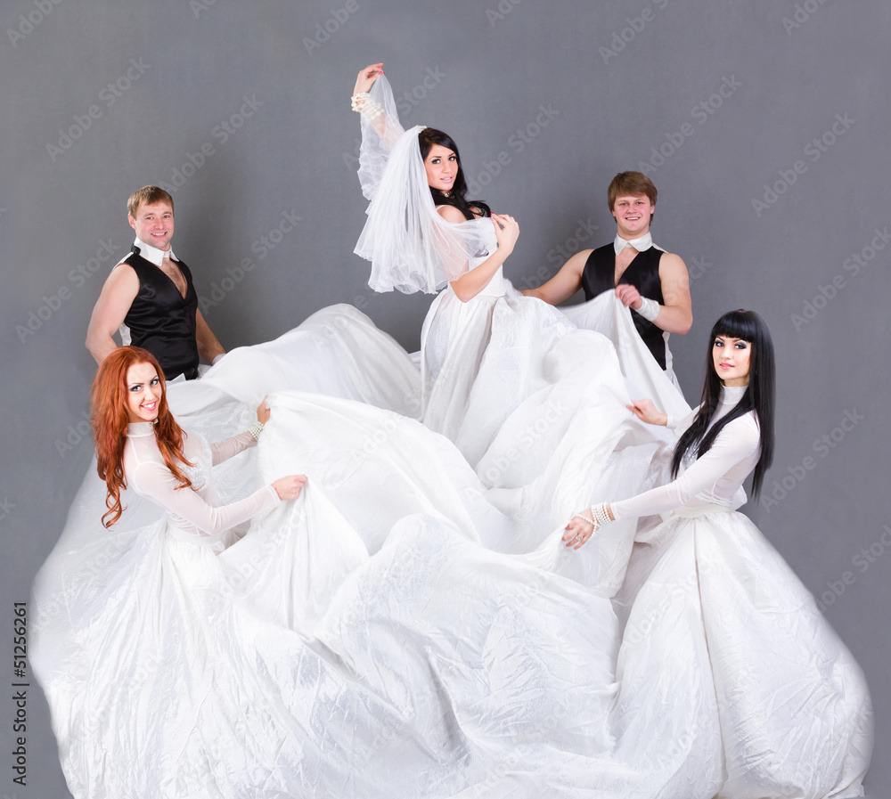 Actors in the wedding dress posing.