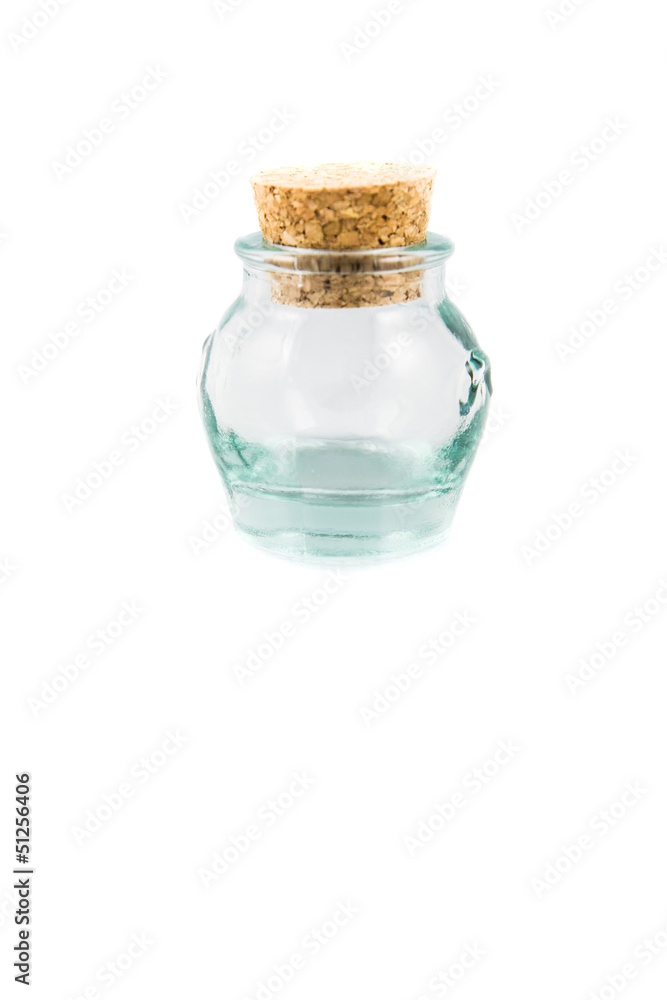 Cork stopper and small glass bottle with white background