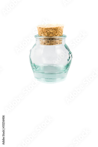 Cork stopper and small glass bottle with white background