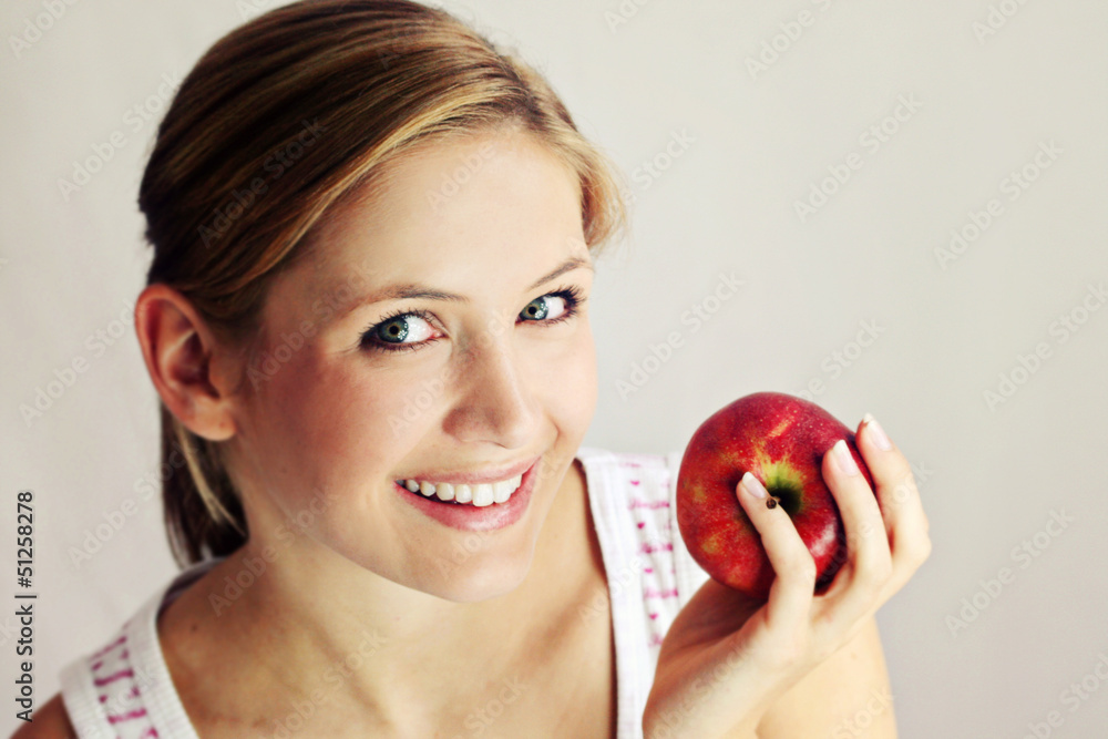 beauty portrait of a young happy woman eating an apple beauty portrait of a young happy woman eating an apple
