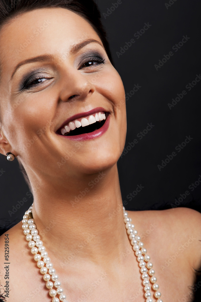 Woman in pary style on black background