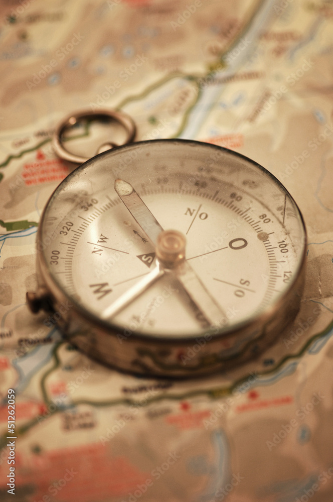 Old compass on map Old compass on map