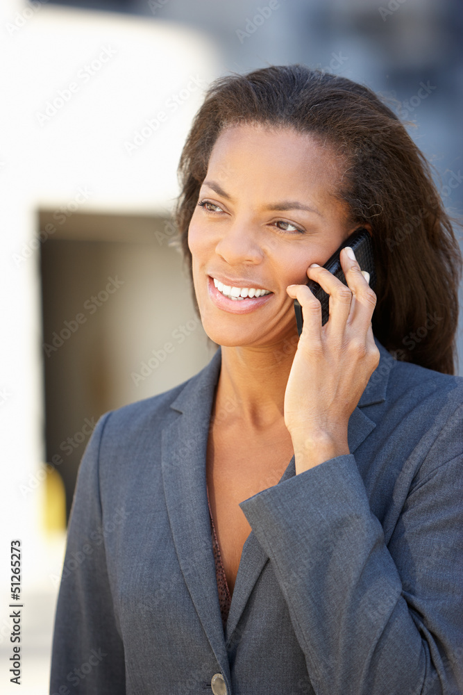 Businesswoman Outside Office On Mobile Phone Businesswoman Outside Office On Mobile Phone