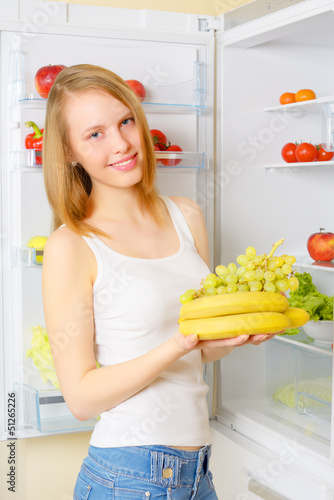 girl near the refrigerator