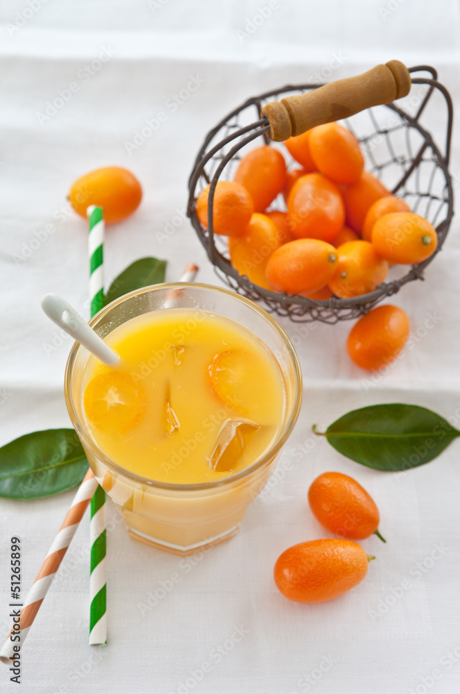 Fresh juice from oranges and kumquats Fresh juice from oranges and kumquats