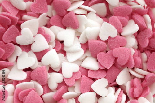 Pink and white sugar hearts background