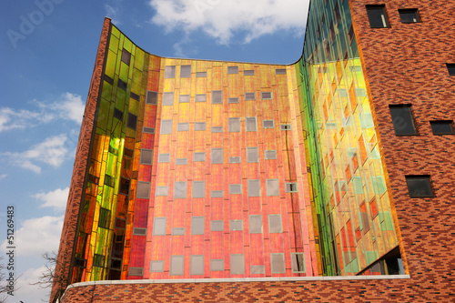 Office building with colorful reflexions in windows