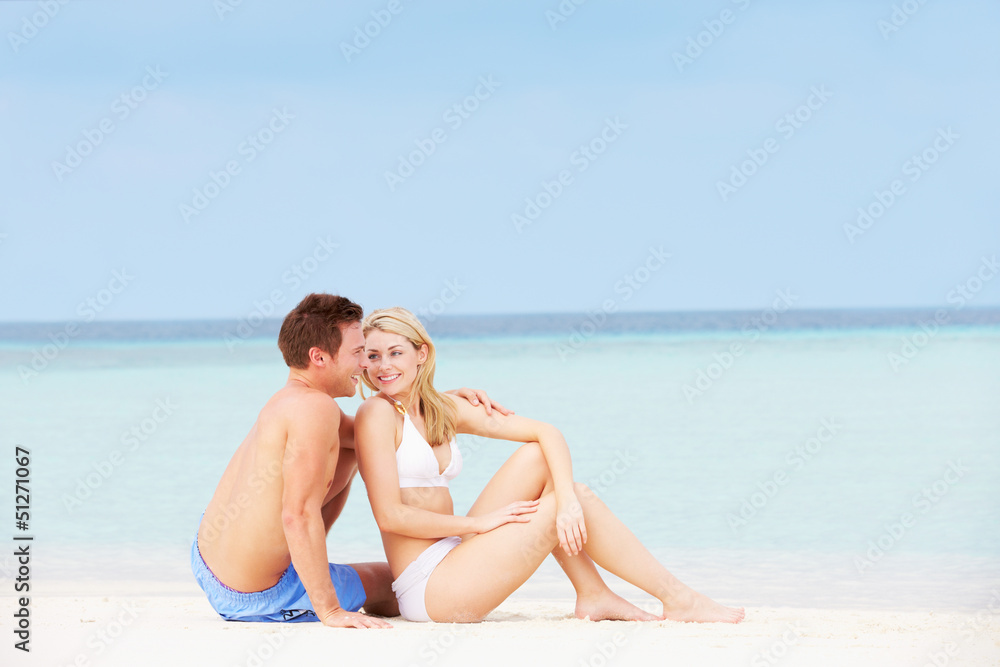 Couple Relaxing On Beautiful Beach Together