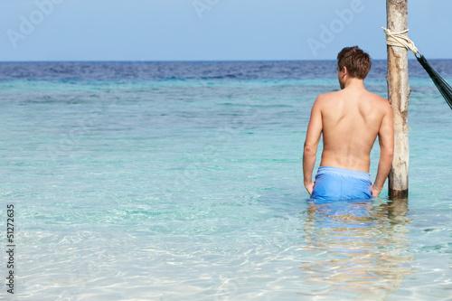 Man Standing In Beautiful Tropical Sea