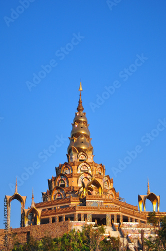 Golden pagoda in the blue sky background at Wat Prathatphasonkae