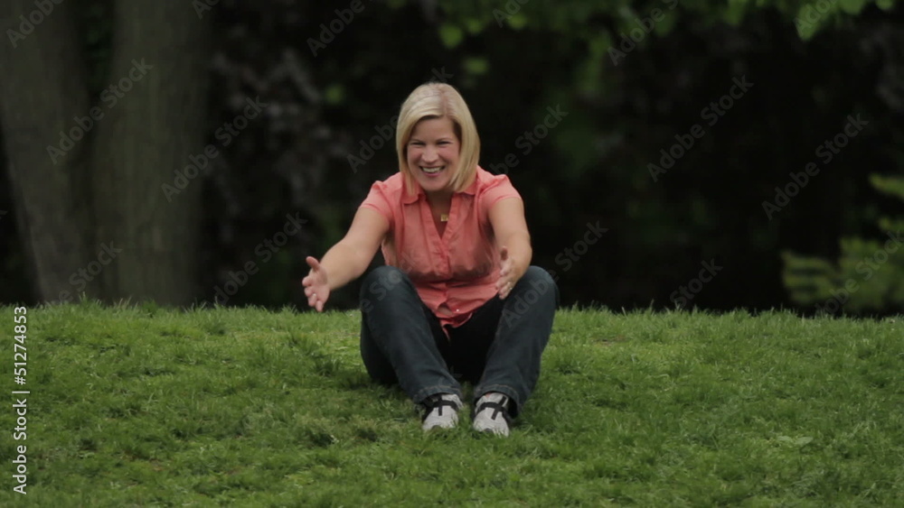 Woman playing with her dog at the park Woman playing with her dog at the park