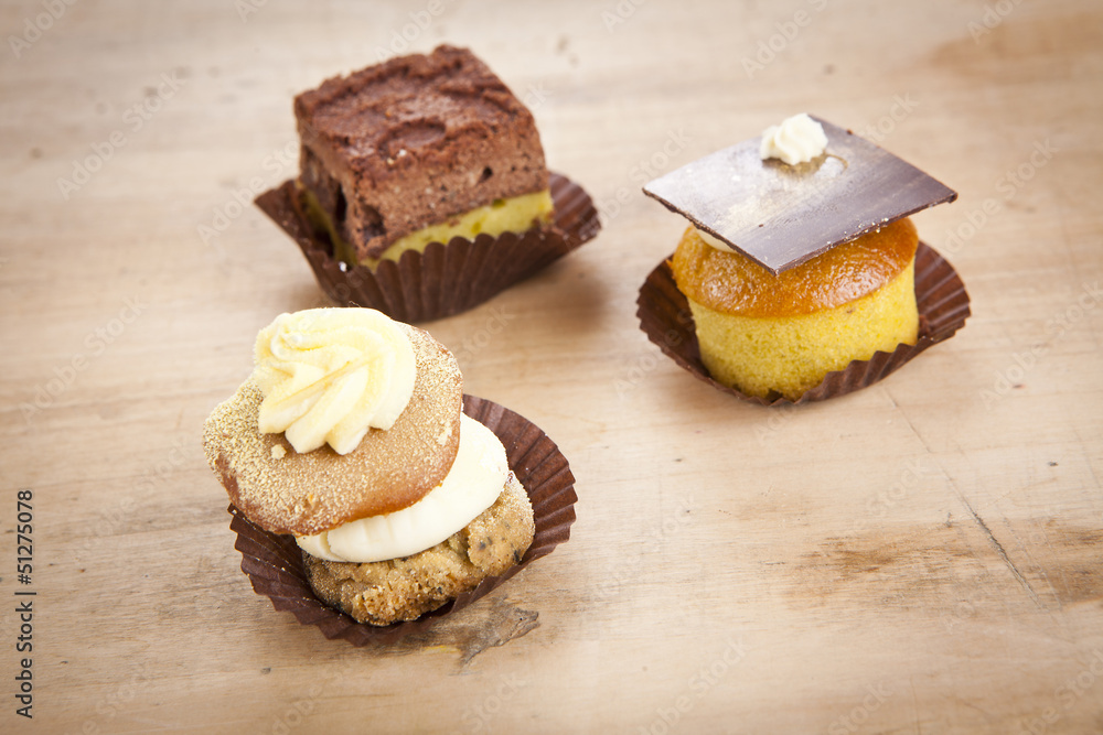 delicious cupcake pastry on wooden background table delicious cupcake pastry on wooden background table