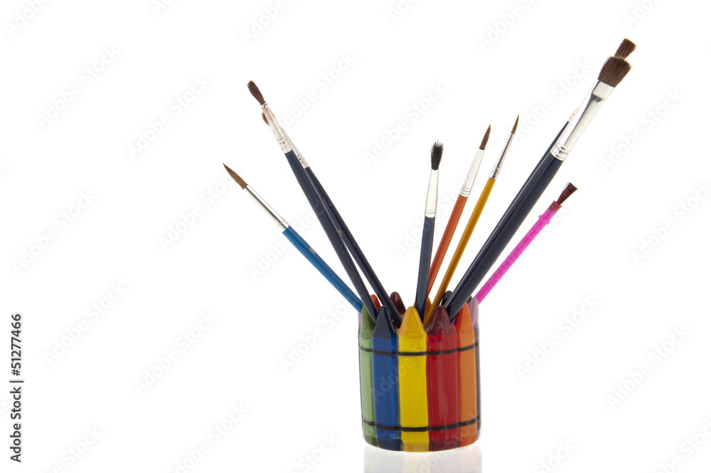 Collage of paintbrushes in a colourfull cup Collage of paintbrushes in a colourfull cup