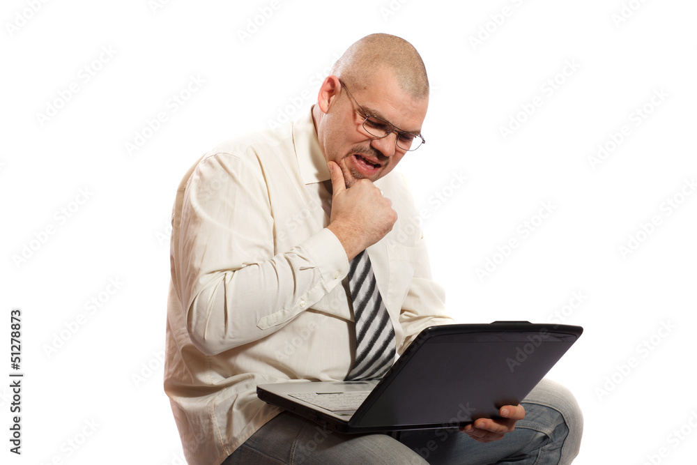 worried man looking at computer