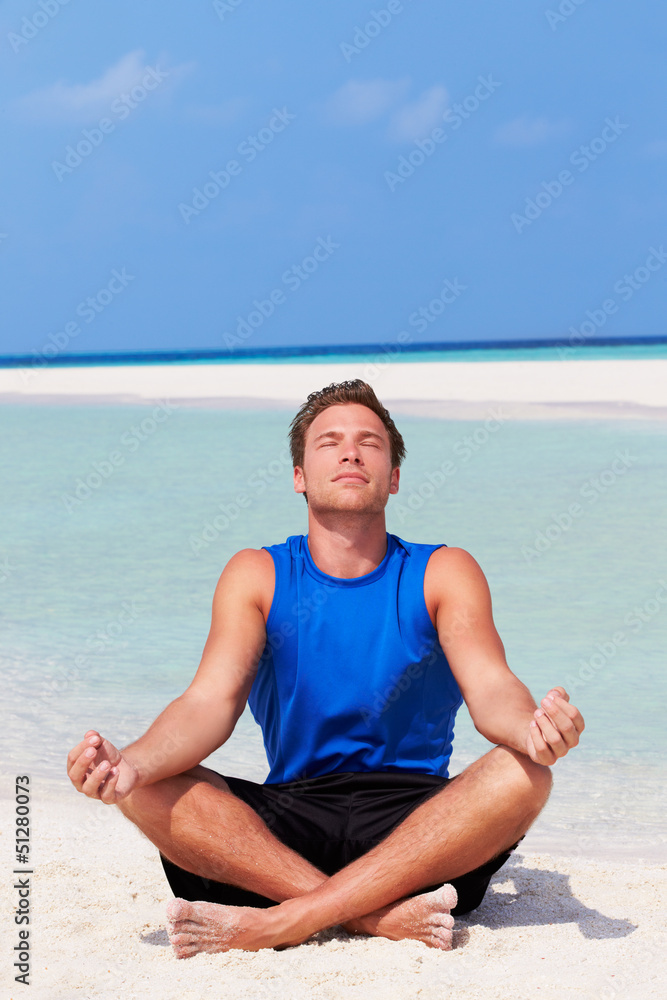 Man Meditating On Beautiful Beach