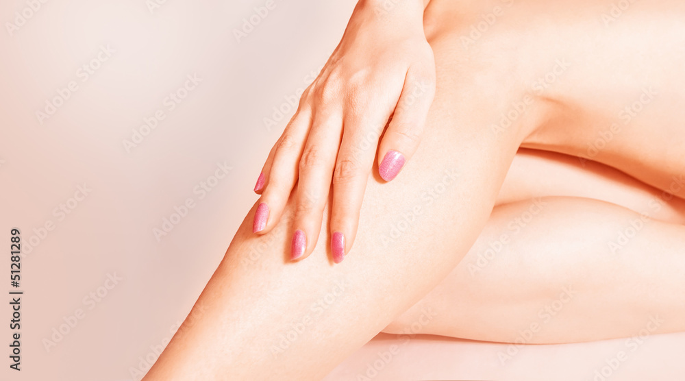 Well-groomed female legs on pink background Well-groomed female legs on pink background